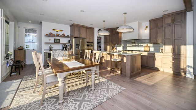 Open kitchen and dining area with natural light and wood cabinetry